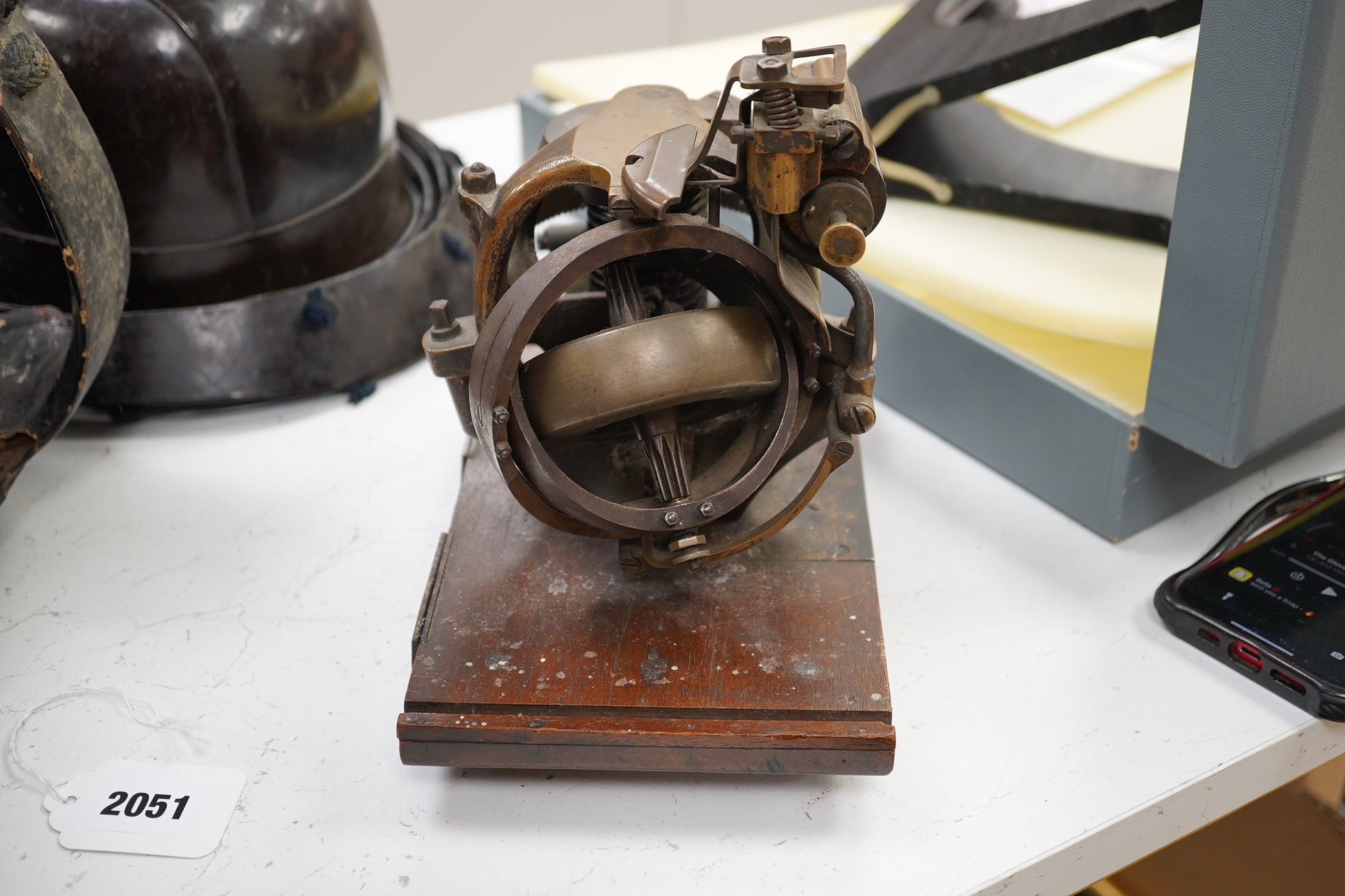 A First World War torpedo gyroscope, stamped 2878 W&Co. top part of the wooden case missing, 21cm high x 24cm wide. Condition - some general wear and damage, unknown if in working order.